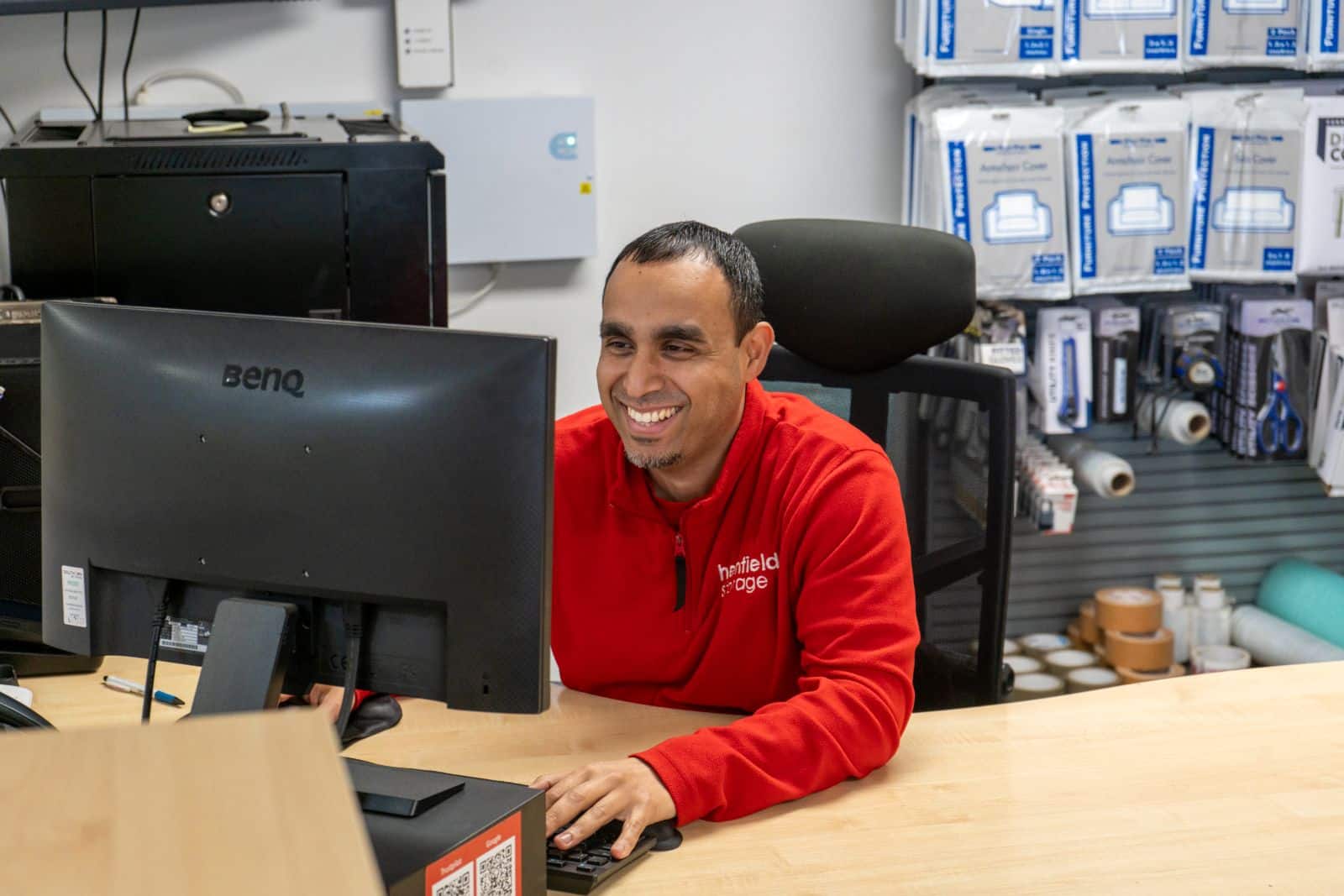 Henfield Storage Staples Corner staff assisting customer at reception